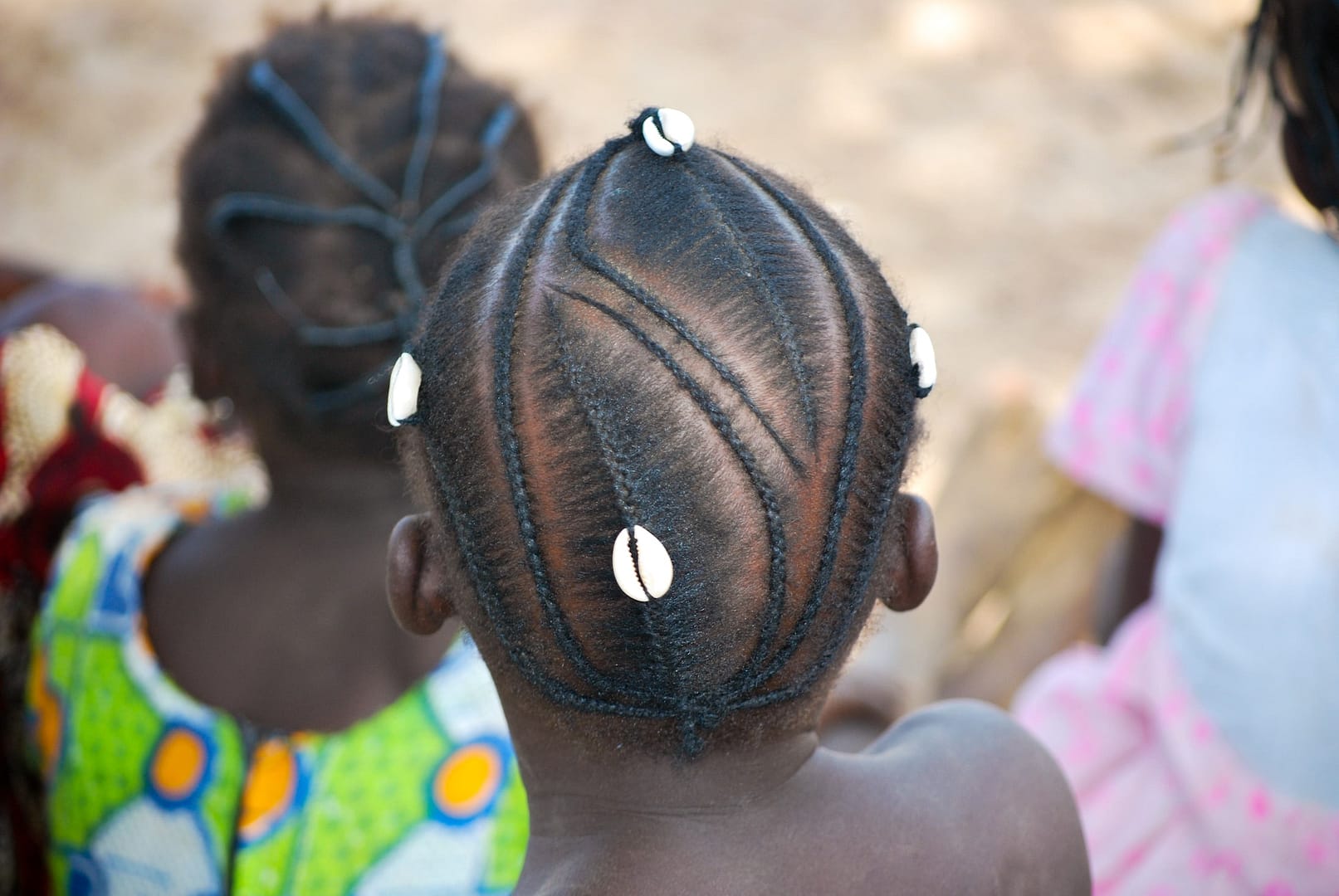 African braids with traditional cauri shell - hairdo cornrow